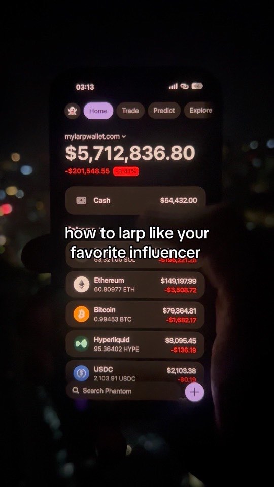 A phone filmed at night against city lights, showing a wallet balance of $5,712,836.80, captioned “how to larp like your favorite influencer”.